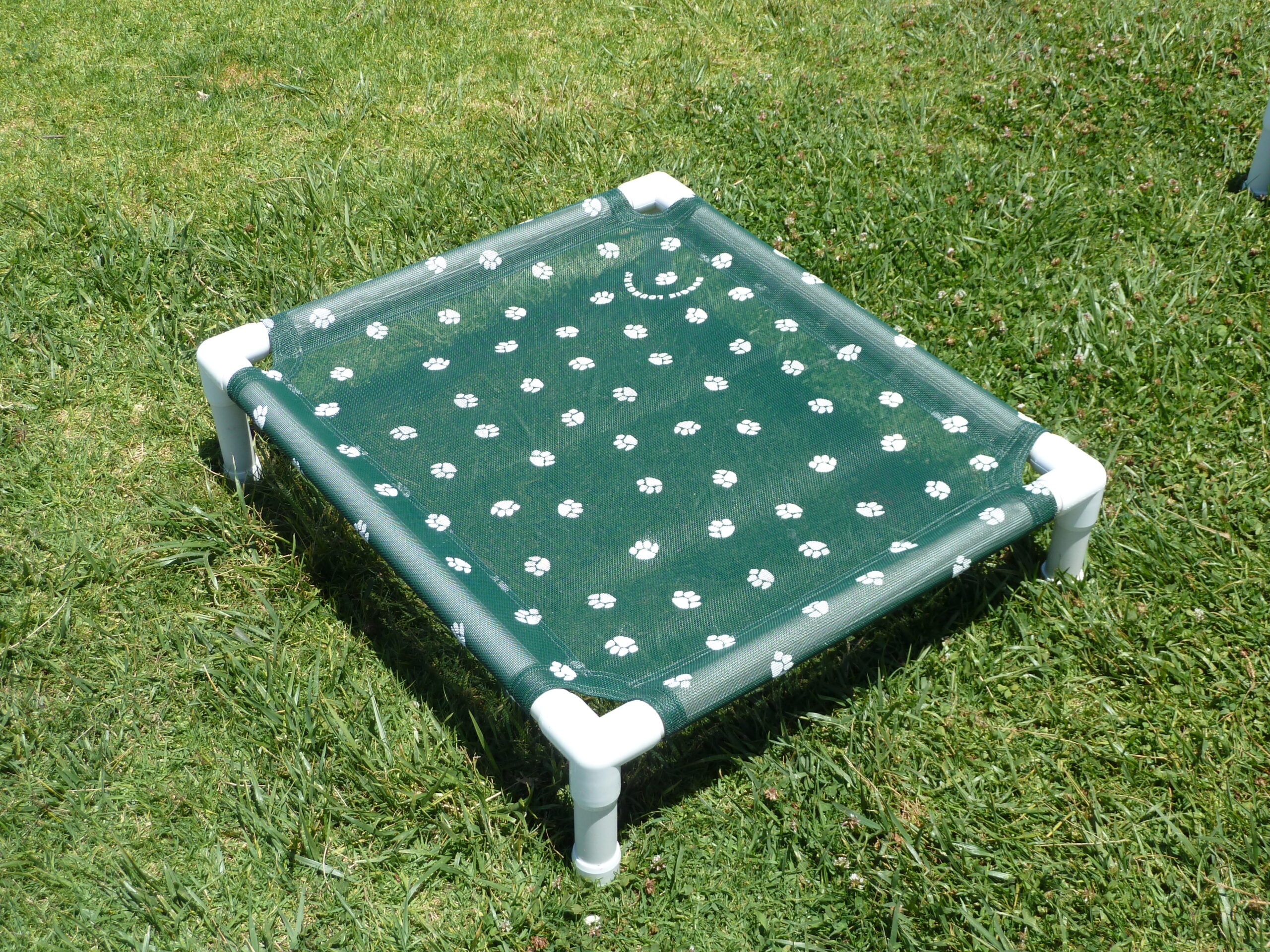 Forest green Doggie Lounger with white paw print mesh