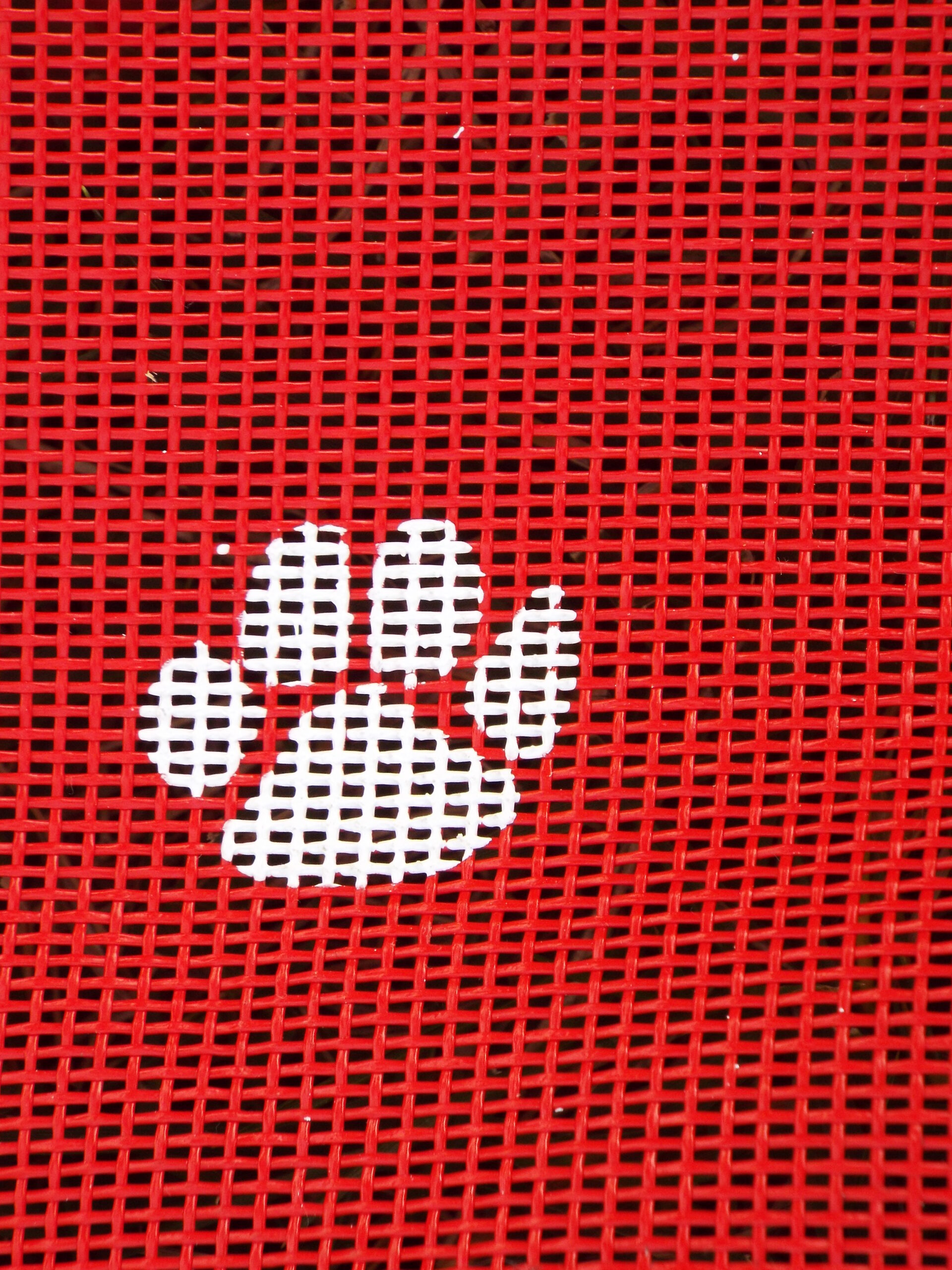 Red Doggie Lounger mesh with white paw prints